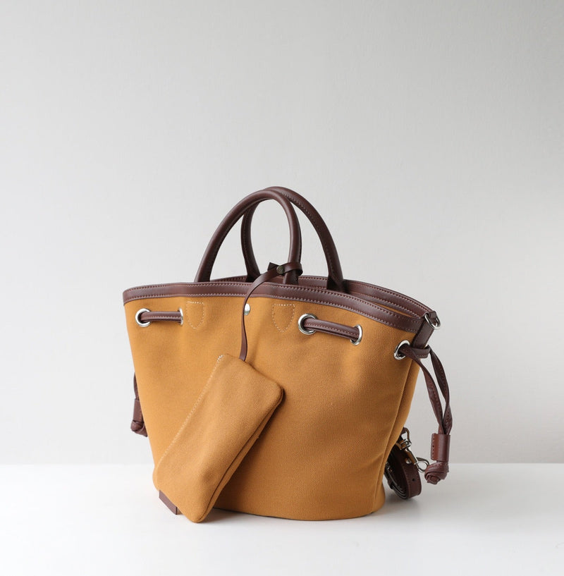 Brown handbag with a matching pouch on a light gray background