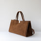 Brown handbag on a white background