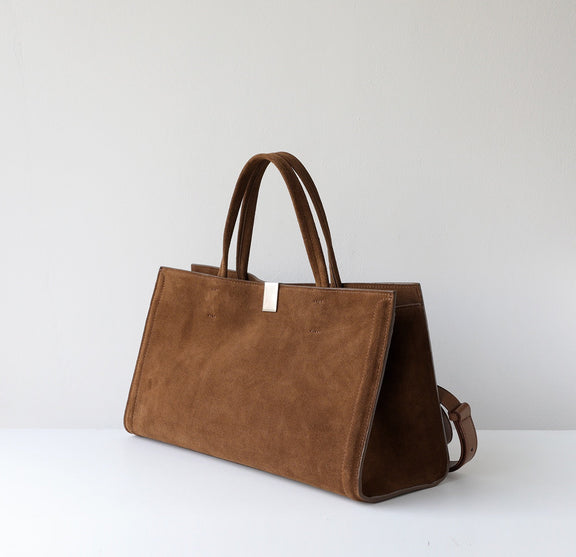 Brown handbag on a white background