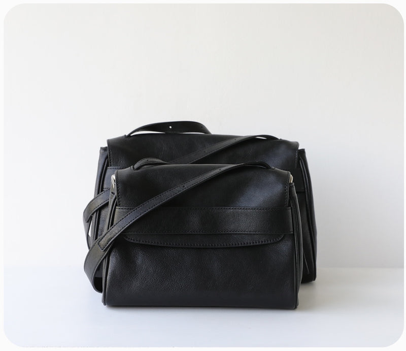 Black leather bag on a white background
