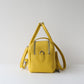 Yellow backpack on a light gray background