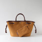 Brown tote bag with matching pouch on a light gray background
