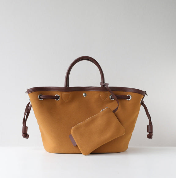Brown tote bag with matching pouch on a light gray background