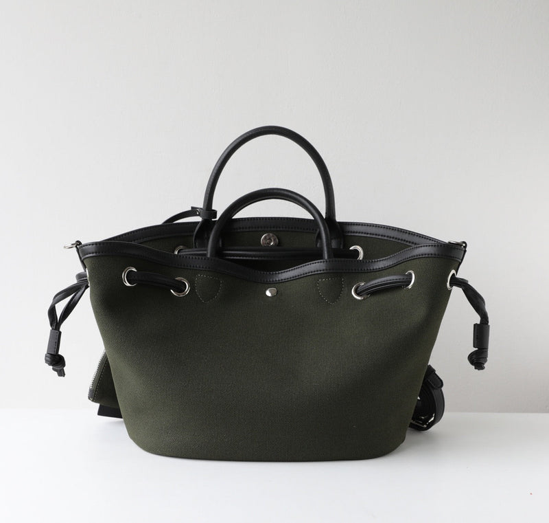 Black leather handbag on a white background