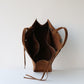 Brown leather bag on a white background