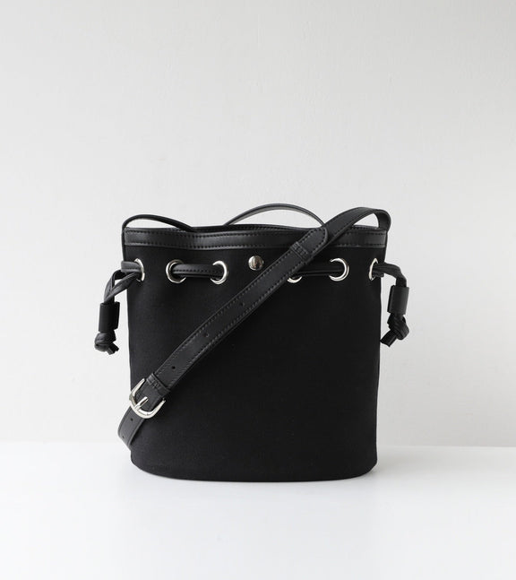 Black bucket bag with a strap on a white background