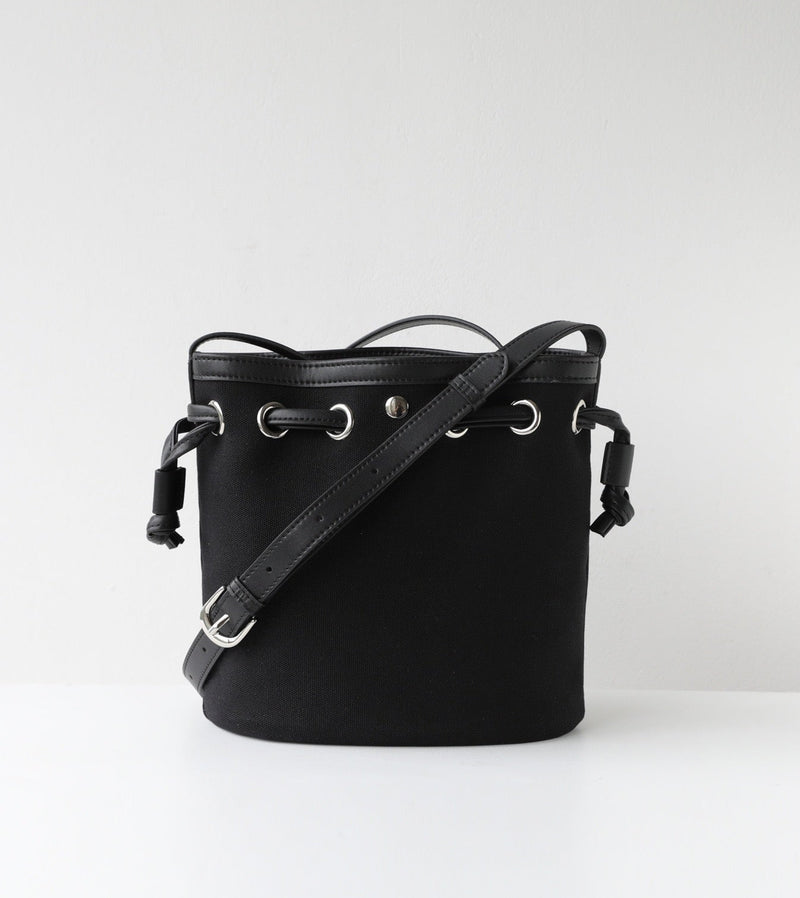 Black bucket bag with a strap on a white background