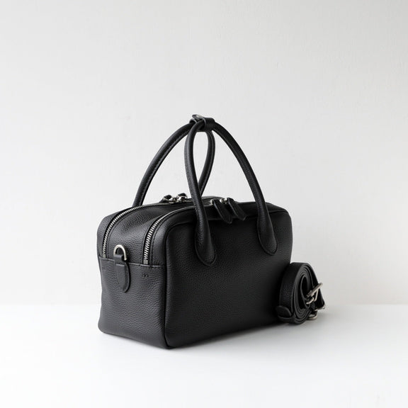 Black handbag on a white background