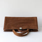 Brown leather nubuck bag on a white background