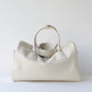 White handbag on a light gray background with 'Product Display' text.