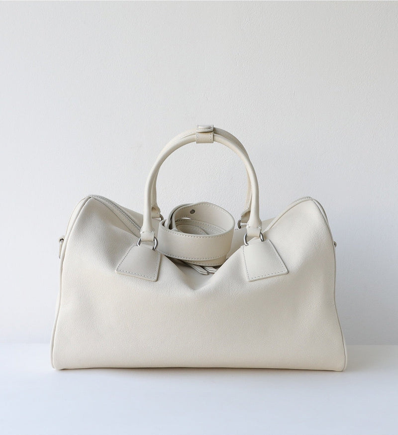 White handbag on a light gray background with 'Product Display' text.