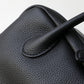Close-up of a black leather glove with a textured surface