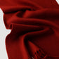 Red wool scarf with fringes on a white background

