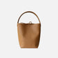 Brown leather bucket bag on a white background